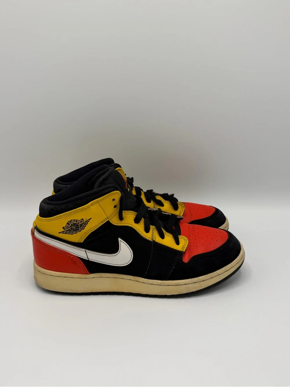 Jordan High-Top Sneakers in Black, Red & Yellow
